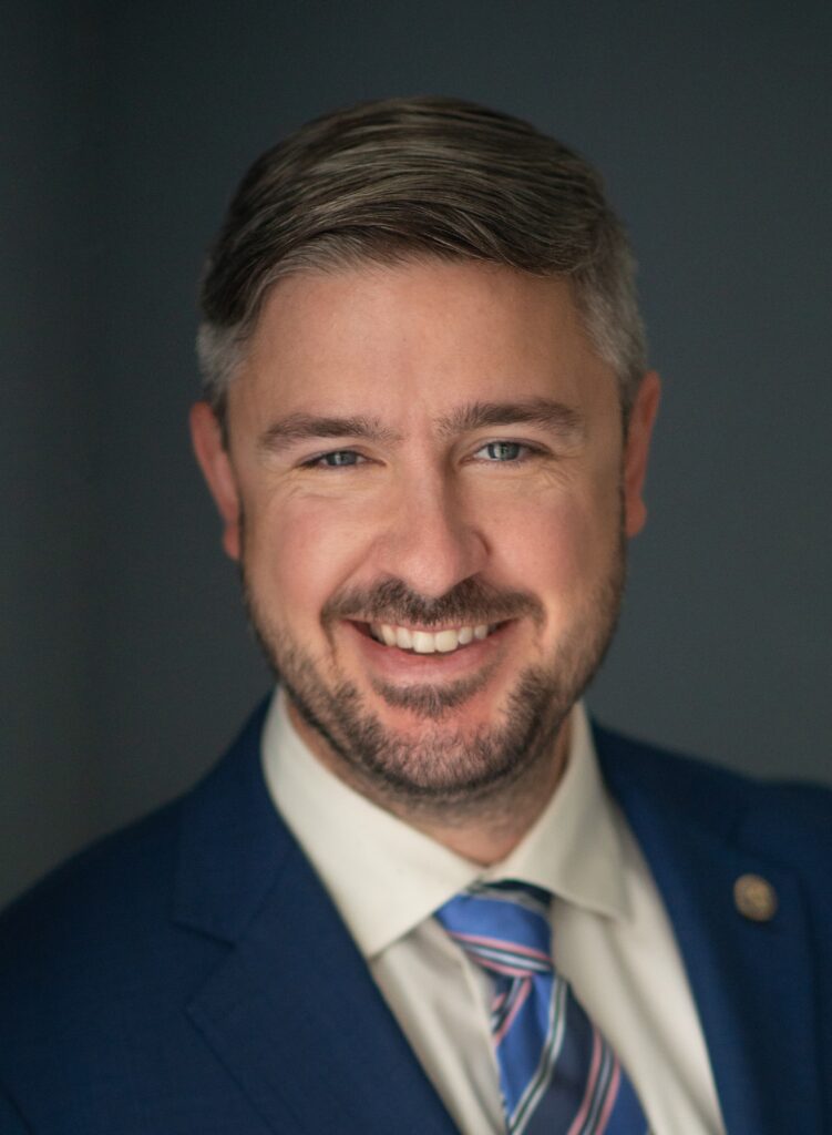 A Picture of David A Seitz in a blue suit.